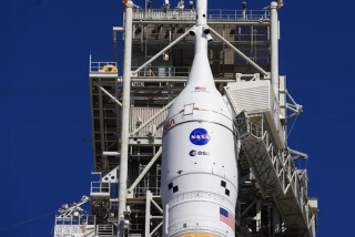 A closeup view shows the Orion spacecraft and launch abort system for NASA’s Artemis II test flight at Launch Complex 39B at Kennedy Space Center in Florida on Tuesday, Feb. 10, 2026.