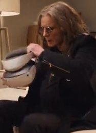 Ozzy Osbourne shown putting on a PSVR2 headset